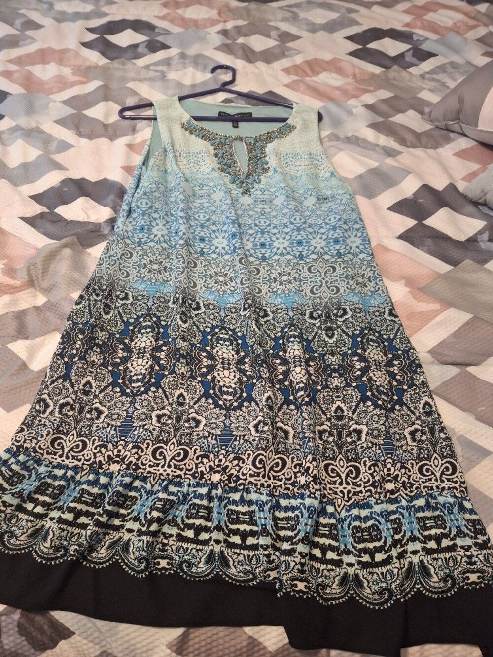 White House Black Market, size large, aqua color with some sequence on the front